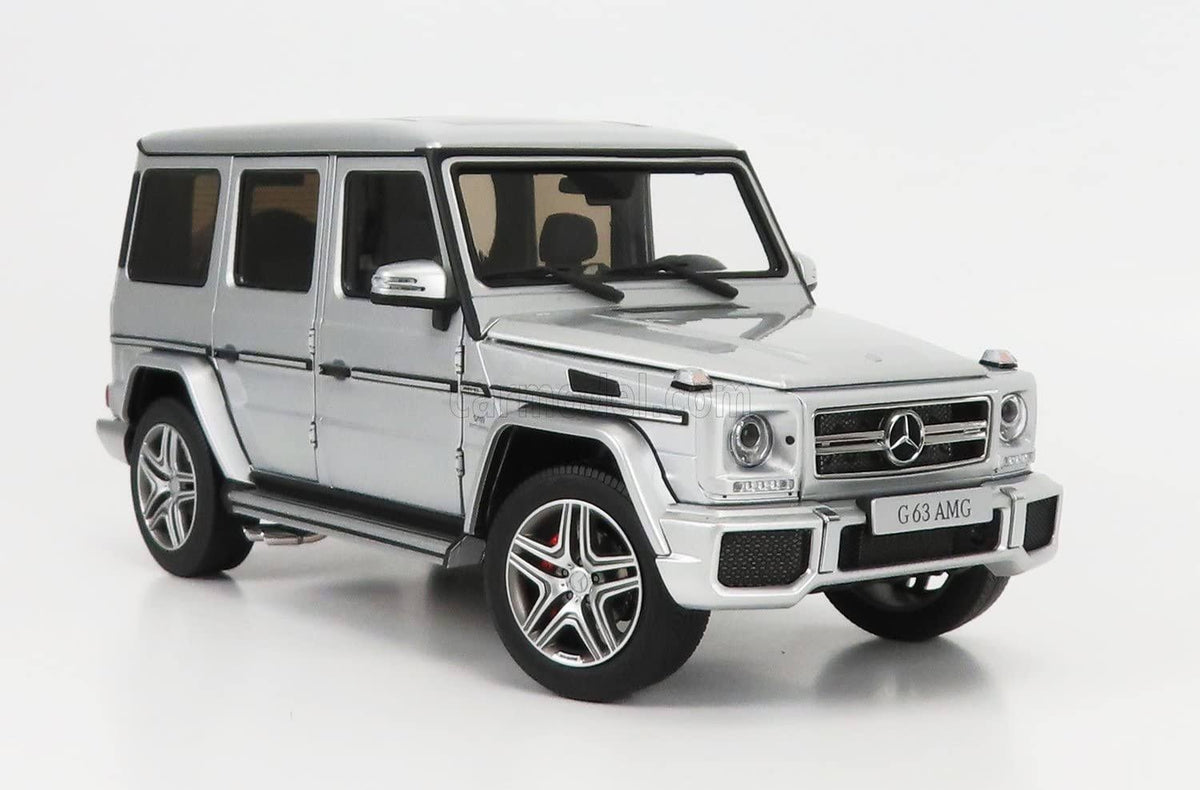 Na slici je beli metalni autić oblikovan po uzoru na Mercedes-Benz AMG G63.