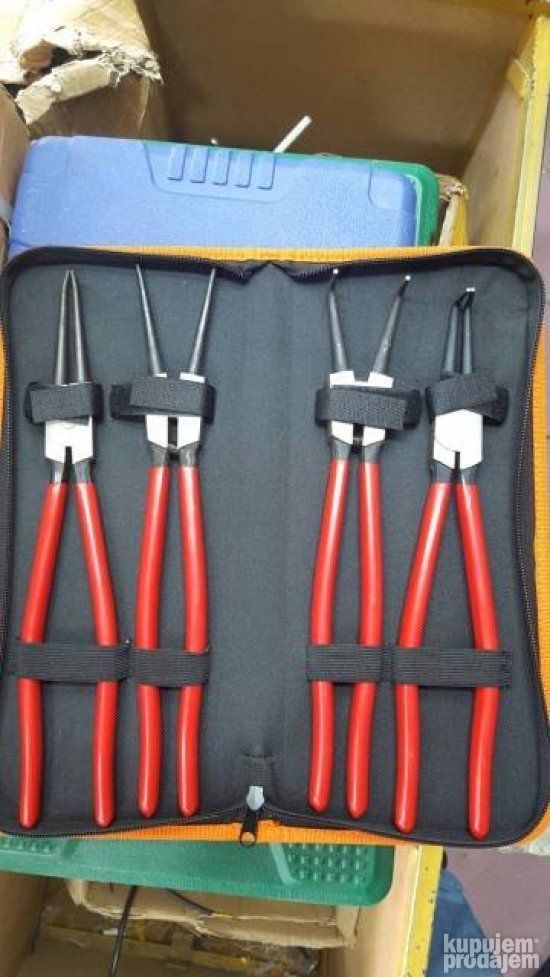 Na slici je set klešta za zegere sa torbicom.
